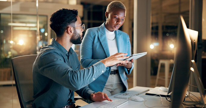 Collaboration, night and tablet with business people in office together for development or planning. Computer, feedback or review with employee man and woman in workplace for project management
