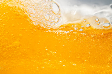 Close up bright orange Oil or beer splash texture and nature waves, Beautiful waves curve and...