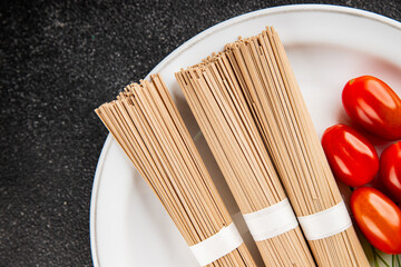 Buckwheat noodles raw soba fresh dish natural food Asian cuisine on the table rustic food top view copy space