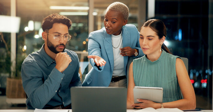 Night, laptop and group of business people in training, planning and discussion for insurance. Computer, office and manager coaching team for help with project, financial policy and problem solving