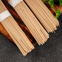 Buckwheat noodles raw soba fresh dish natural food Asian cuisine on the table rustic food top view copy space
