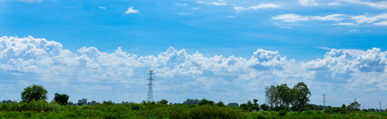 Obraz premium Power Line Transmission Tower on a Dry, Dusty Landscape