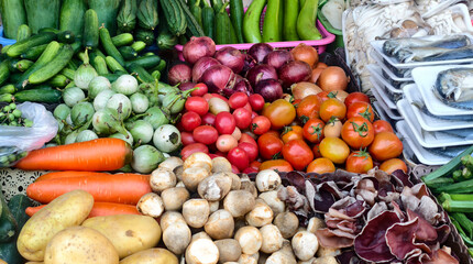 Vibrant Market Display of Fresh Vegetables and Fruits at Local Farmer's Stall in Natural Setting