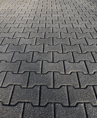 Natural gray granite stone pavement surface detail. Sone pavement texture, gray tiles.