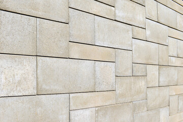 Natural brown gray granite stone pavement surface detail. Sone wall background. 