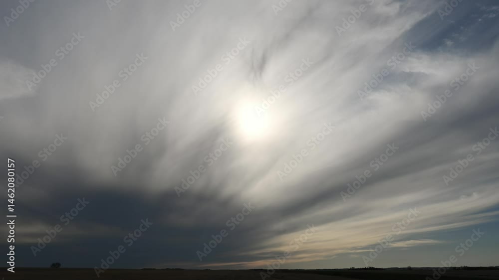 Sticker time lapse of dramatic radiating clouds as they slowly move towards the viewer