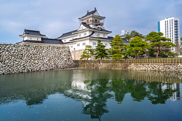 The former Toyama Castle and blossoms bloom over the ramparts and the moat, Toyama Castle Park is popular landmark tourist toyama city, Japan.