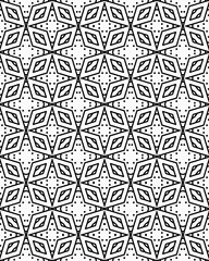 A detailed geometric arrangement of hexagons and leaf shapes creates a striking black and white pattern on a crisp background