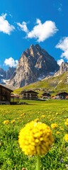 A picturesque mountain village with yellow wildflowers, rustic houses, and rugged peaks beneath a bright blue sky with scattered clouds.