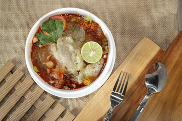 A bowl of spicy aci soup. Delicious spicy aci soup dish