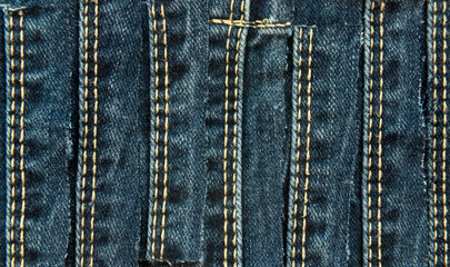 Fototapeta premium Texture from torn pieces of denim. Jeans texture. Material for sewing clothes