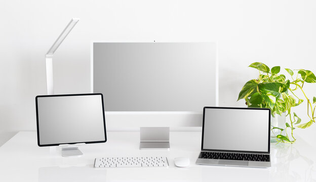 Mockup of different computers and tech gadgets on desk