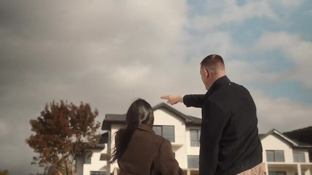 family choose a large country house to buy