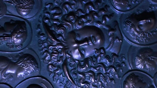 greek gods. head of medusa gorgon, rotating relief