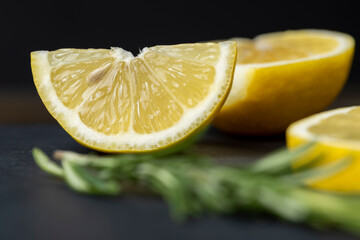 lemon on a slate board, freshly sliced lemon on a black board