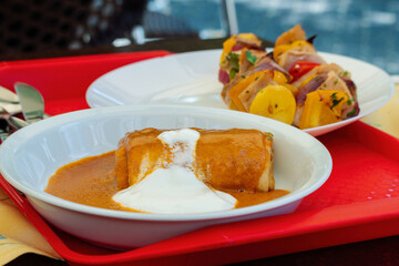 Hungarian traditional food. Meat-Filled Crepes (Hortobágyi palacsinta). Savory pancakes with a meat filling topped with a heavenly paprika sauce.