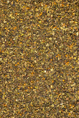 tea leaves, ground and crumbled into very small pieces with the addition of flavoring and aromatic additives, closeup