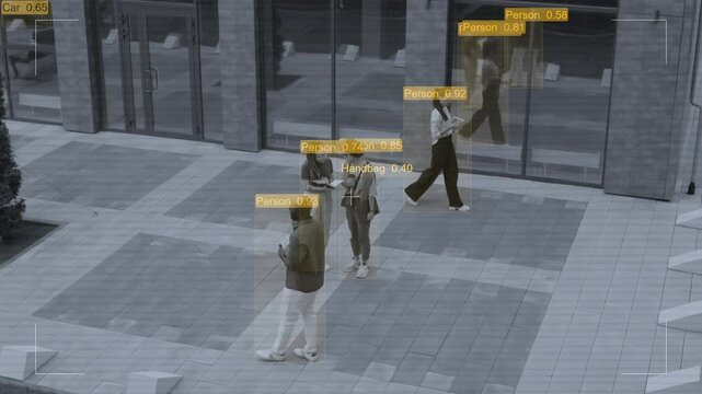 CCTV shot with visual effects identifying people and objects on private property, business colleagues walking and talking in courtyard during lunch break