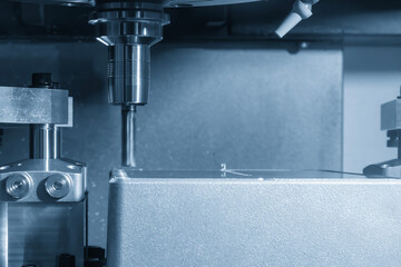 The CNC milling machine rough cutting the aluminum housing parts with flat nose end mill tool.