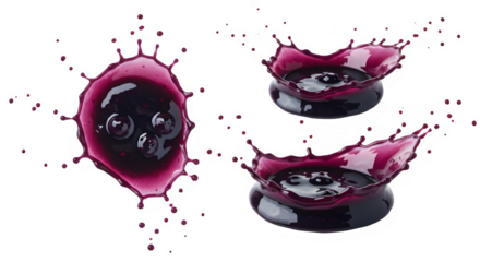Three splashes of blueberry jam, showcasing the vibrant purple color and juicy texture.