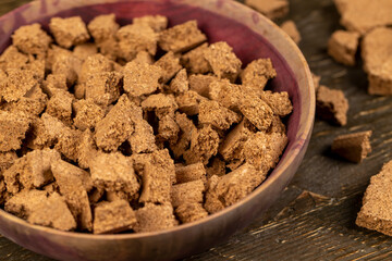 small pieces of cork bark for domestic use pieces in a wooden bowl