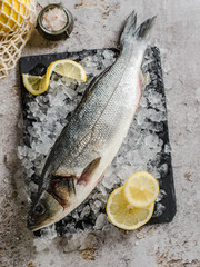 raw dorada on ice with lemon