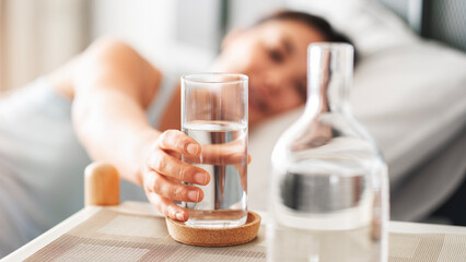 Woman holding a glass of drinking water