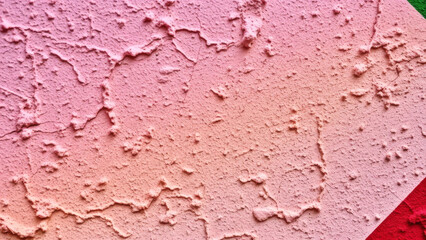 Vibrant LGBTQ symbol on a textured wall with soft pastel hues backgrou