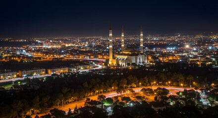 Naklejka premium Mosque at Night in City Skyline