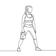 Fototapeta premium Woman lifting kettlebell in fitness attire against plain background 