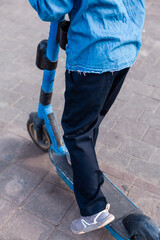 A woman and a teenager interact with an electric scooter using a smartphone — urban mobility meets smart tech. Eco-friendly transport for the modern city lifestyle