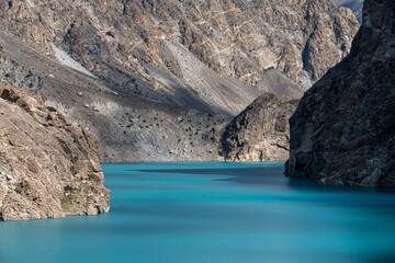 Attabad Lake at Dawn captured between dramatic canyon walls in Hunza Valley, Gilgit-Baltistan, Pakistan.