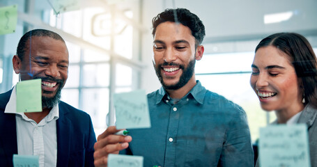 Collaboration, glass wall and laughing with business people in office for brainstorming or strategy. Conversation, ideas or sticky notes with funny employee team in workplace for development