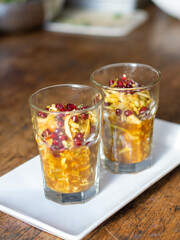 Indonesian shredded fruit salad or rujak serut in glass on wooden table