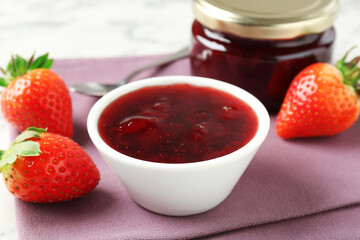Delicious strawberry sauce and fresh berries on white table, closeup