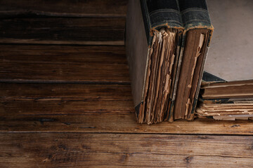 Many old books on wooden table, closeup. Space for text