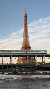 Metro Passing Eiffel Tower at Sunset in Paris