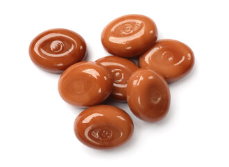 Tasty sweet caramel candies isolated on white, top view
