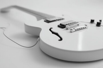 minimalistic electric guitar against white background clean lines defining its shape with abundant copy space