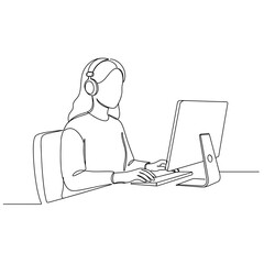 Woman using computer for video interview while wearing headphones 