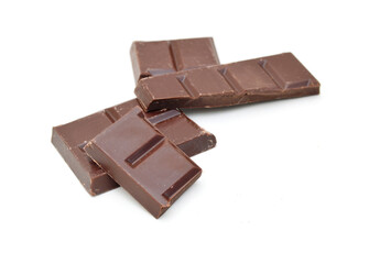 Chocolate candy and pieces on white background