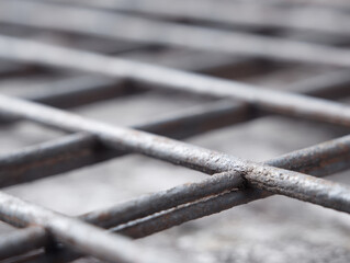 Close up of lattice steel grid with blurred background