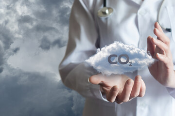 Medical professional holding a cloud with CO2 symbol