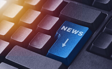 The news button on a black keyboard. Computer keyboard button