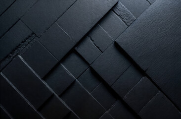 Textured black surfaces arranged in a geometric pattern showcasing design elements in a modern workspace
