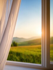 Serene sunrise view from a window overlooking lush green fields and distant mountains