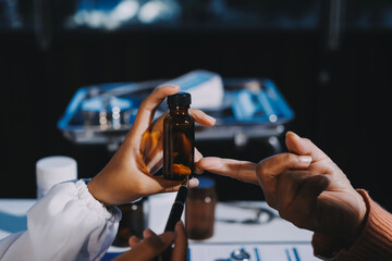 Specialized doctor is explaining taking medicine to a patient. Health and medicine consultation.