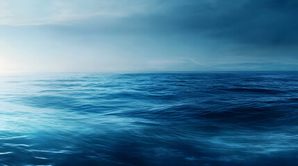 Obraz premium A minimalist wallpaper with a gradual gradient from deep blue to light teal, offering a serene and relaxing digital space.