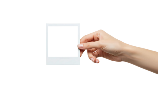 A hand holds a polaroid blank picture isolated on transparent background 