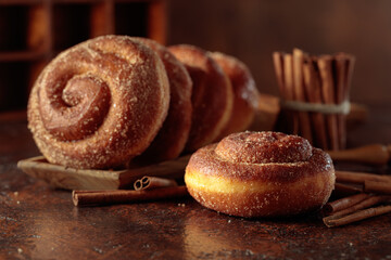 Swedish cinnamon rolls on a brown background.